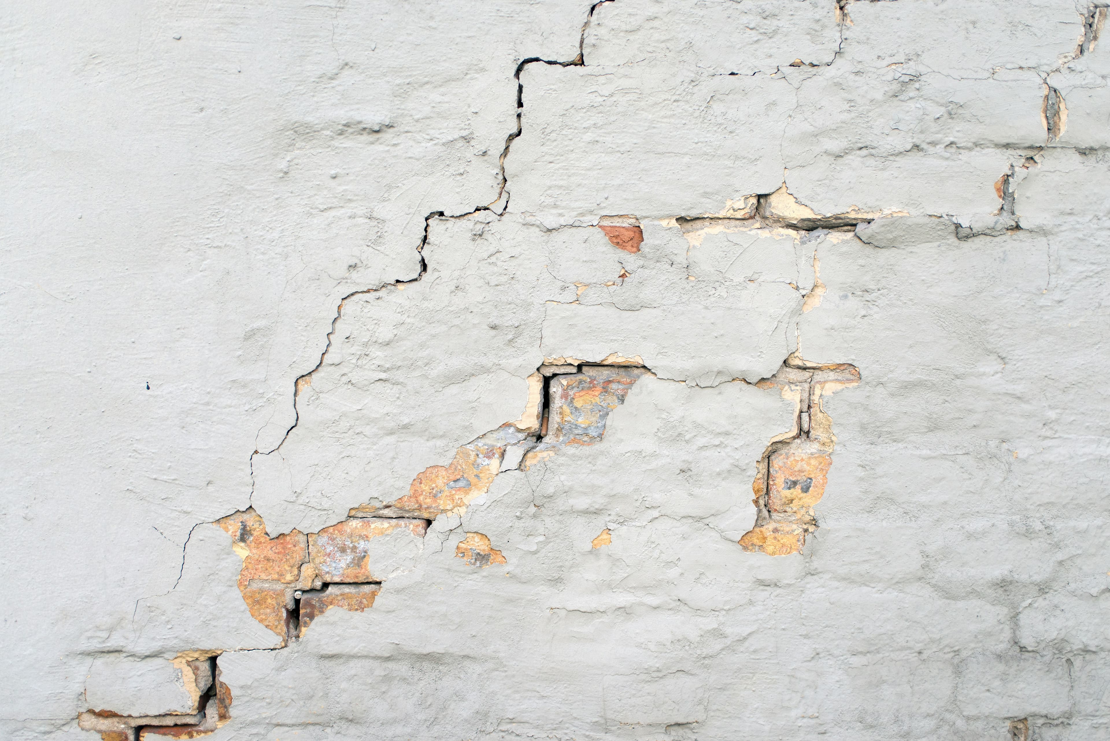 Cracked wall surface requiring professional repair and protective coating